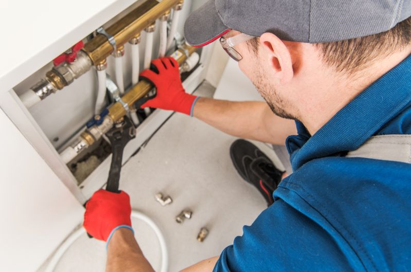 Plumber Consulting with Homeowner